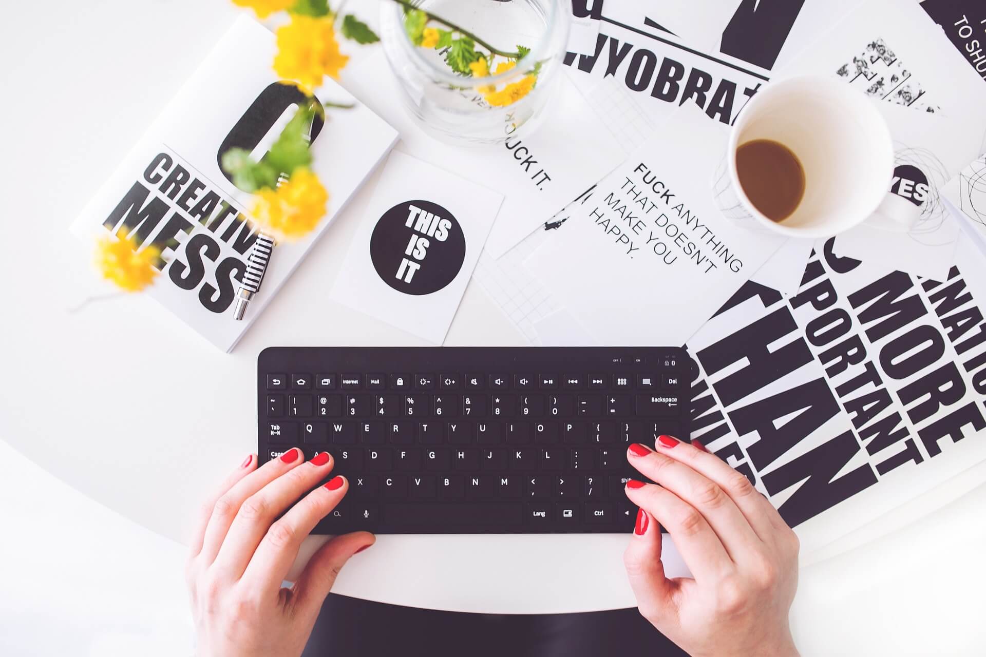 Writing journal critique paper on a computer keyboard